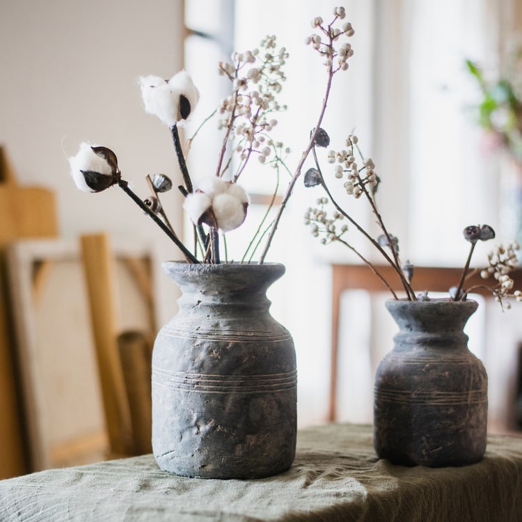 Restoration Style Concrete Vase in gray, showcasing its elegant design and sturdy construction, available in small and large sizes.