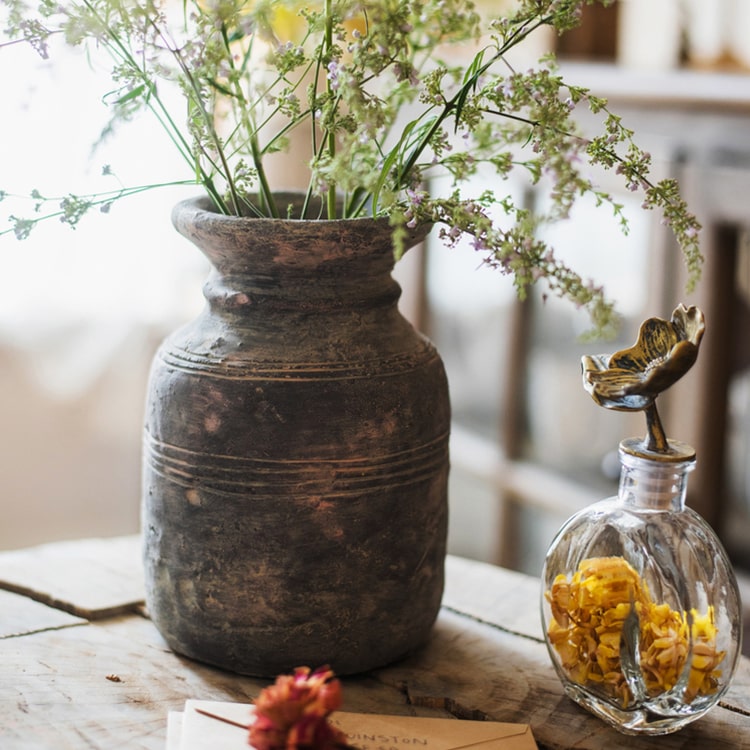 Restoration Style Concrete Vase in gray, showcasing its elegant design and sturdy construction, available in small and large sizes.