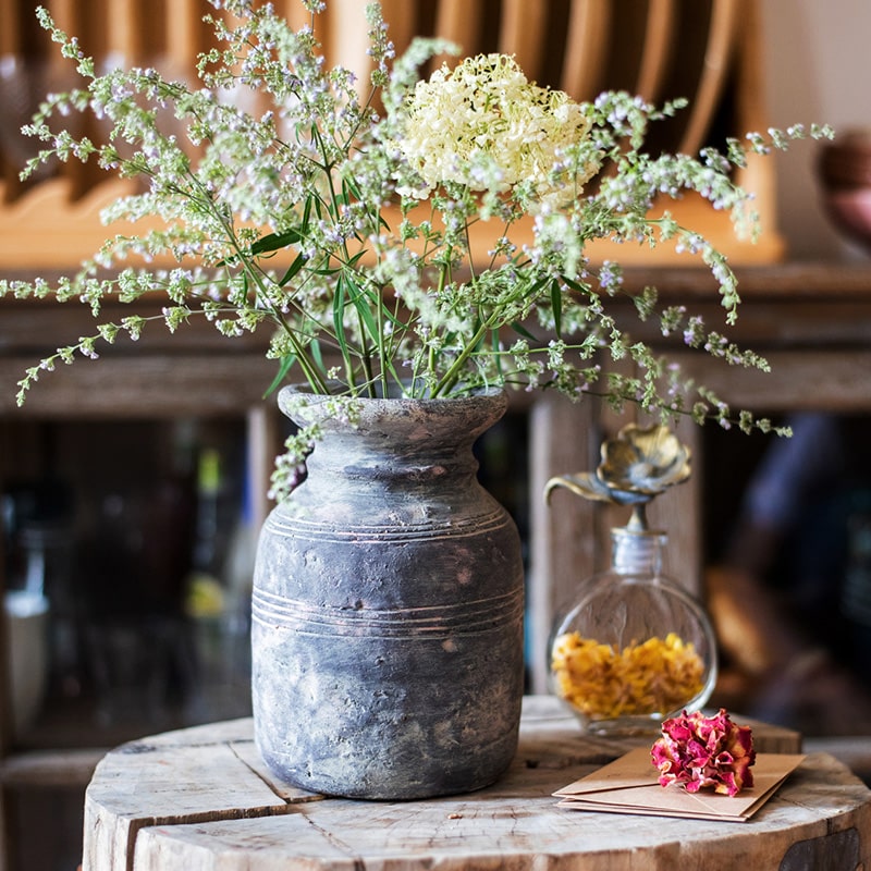 Restoration Style Concrete Vase in gray, showcasing its elegant design and sturdy construction, available in small and large sizes.