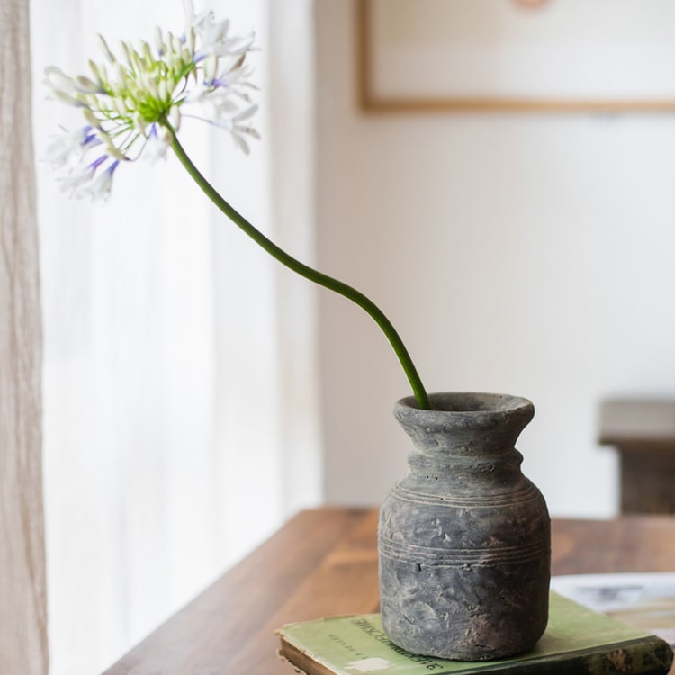 Restoration Style Concrete Vase in gray, showcasing its elegant design and sturdy construction, available in small and large sizes.