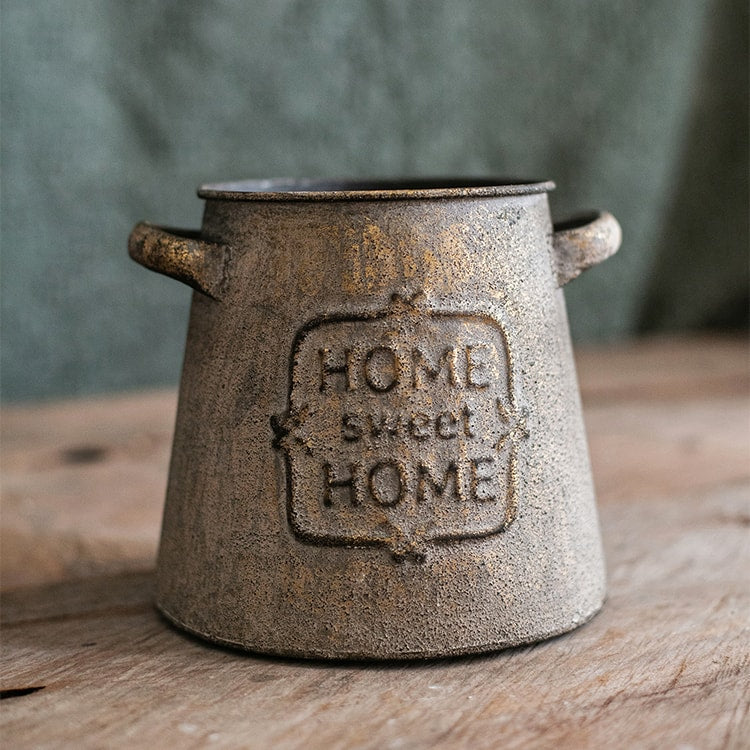 Restoration Sweet Home Flower Pot in rusty gold finish, showcasing its elegant design and sturdy metal construction.