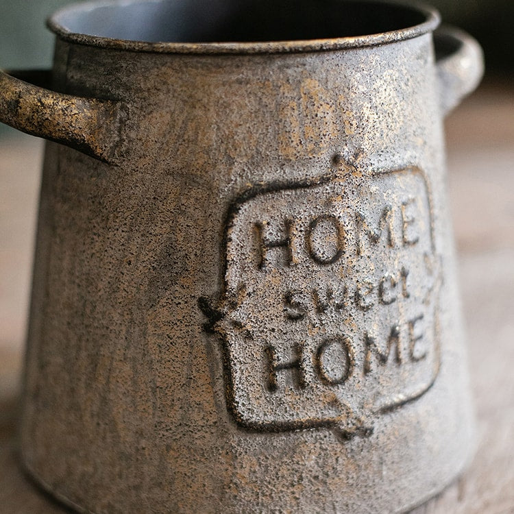 Restoration Sweet Home Flower Pot in rusty gold finish, showcasing its elegant design and sturdy metal construction.