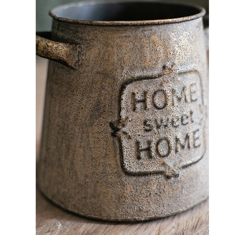 Restoration Sweet Home Flower Pot in rusty gold finish, showcasing its elegant design and sturdy metal construction.