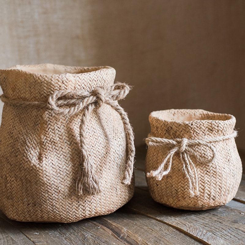 Ribbon Bag Style Concrete Garden Pot in khaki color with hemp rope detailing, showcasing its unique design and drainage hole.