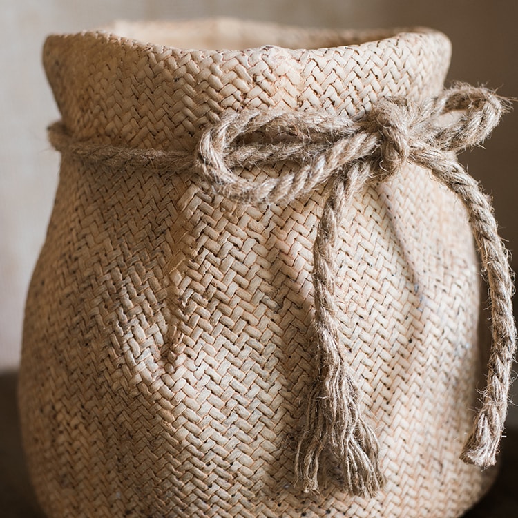 Ribbon Bag Style Concrete Garden Pot in khaki color with hemp rope detailing, showcasing its unique design and drainage hole.