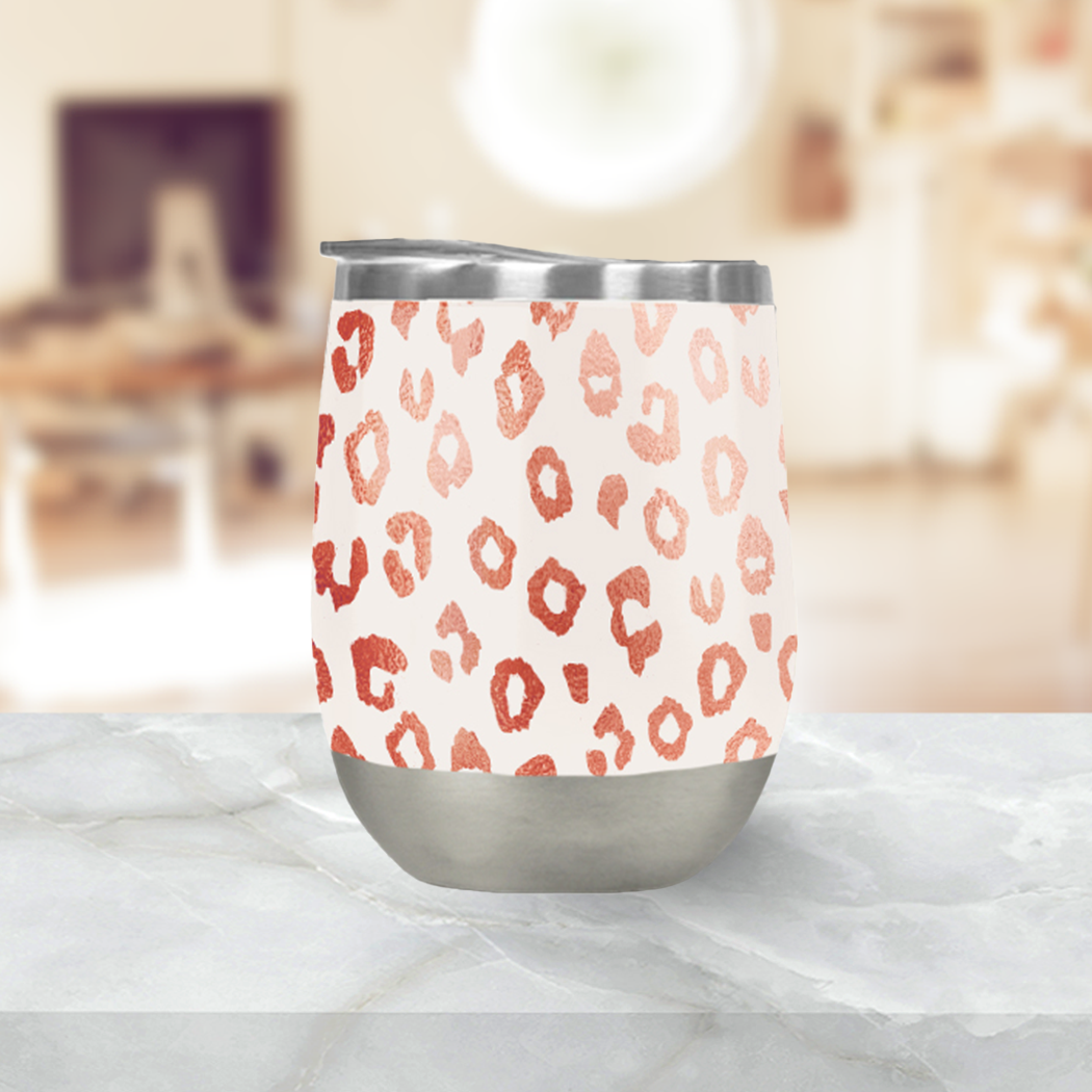 Rose Gold Leopard Print Wine Tumbler with double-wall insulation, stylish design, and secure lid, perfect for outdoor use.