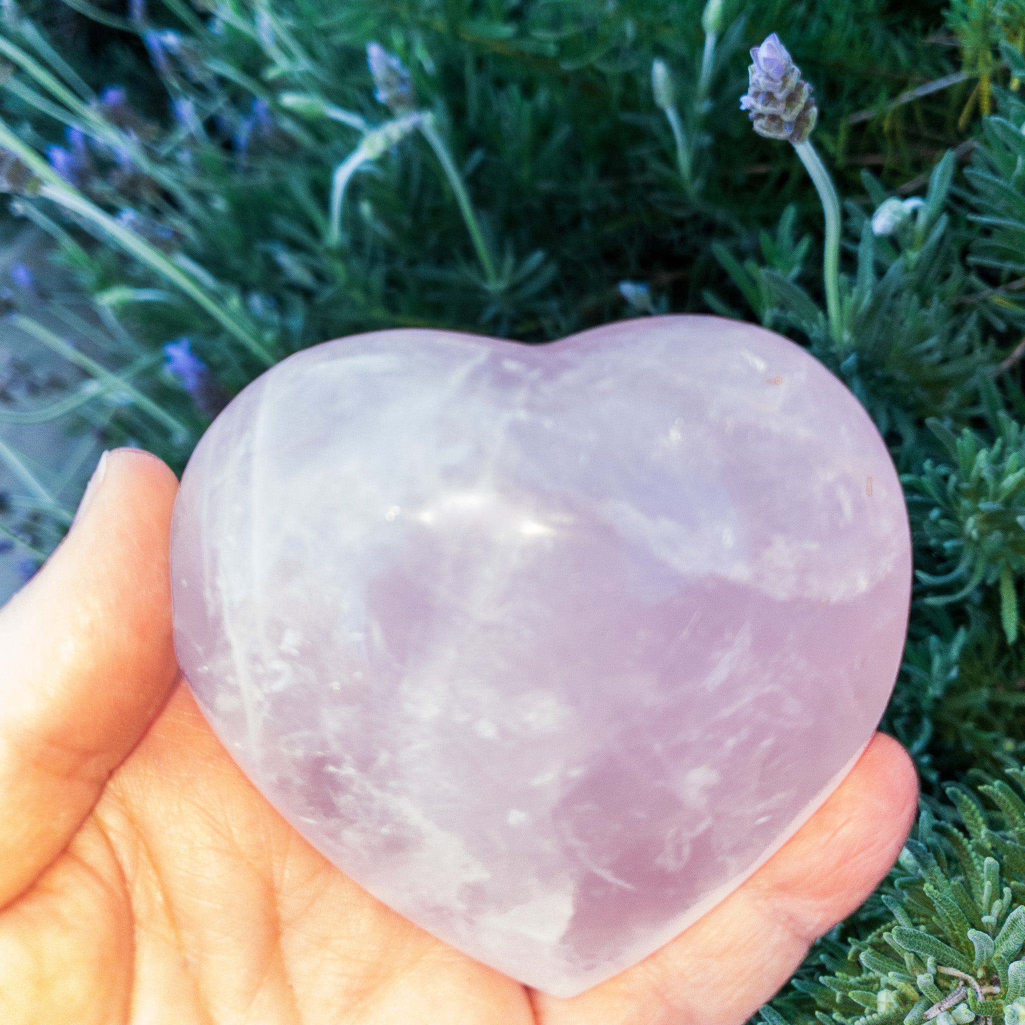 A collection of beautiful rose quartz hearts, showcasing their soft pink color and unique shapes, perfect for decoration or gifting.