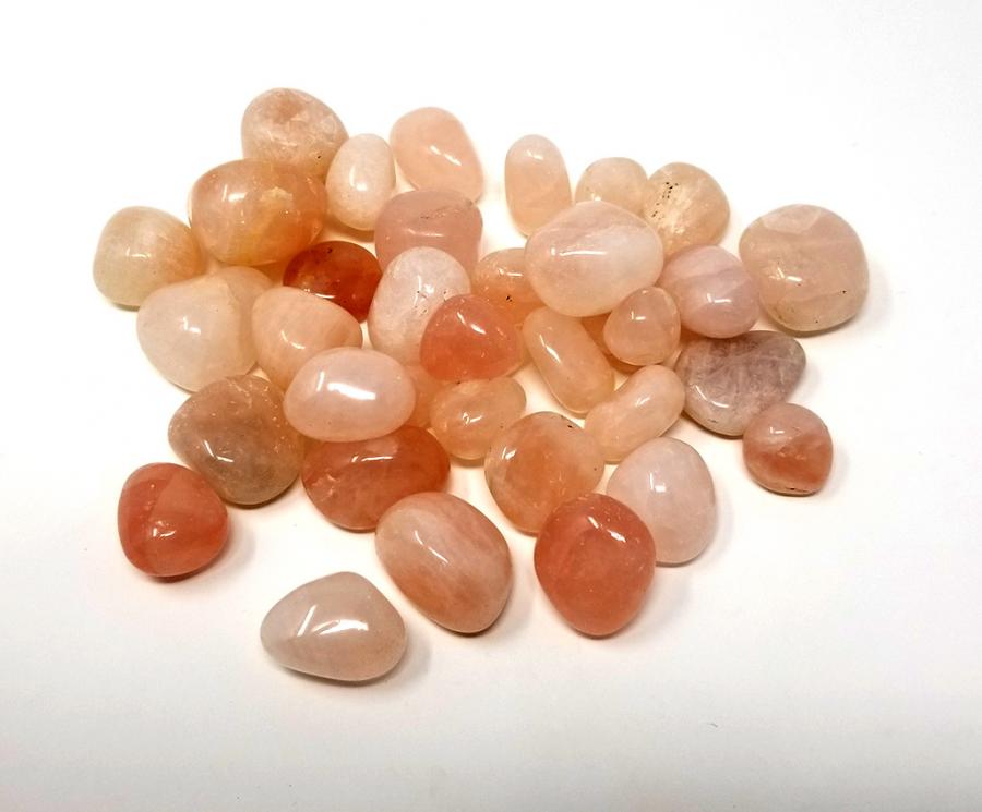 A polished 1-inch piece of Rose Quartz Tumbled Gemstone, showcasing its soft pink hue and smooth surface, ideal for emotional healing.