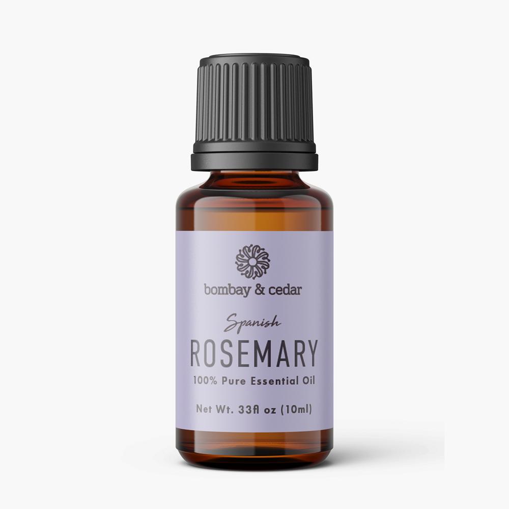 A 10ml bottle of Rosemary Essential Oil with a green label, surrounded by fresh rosemary sprigs.