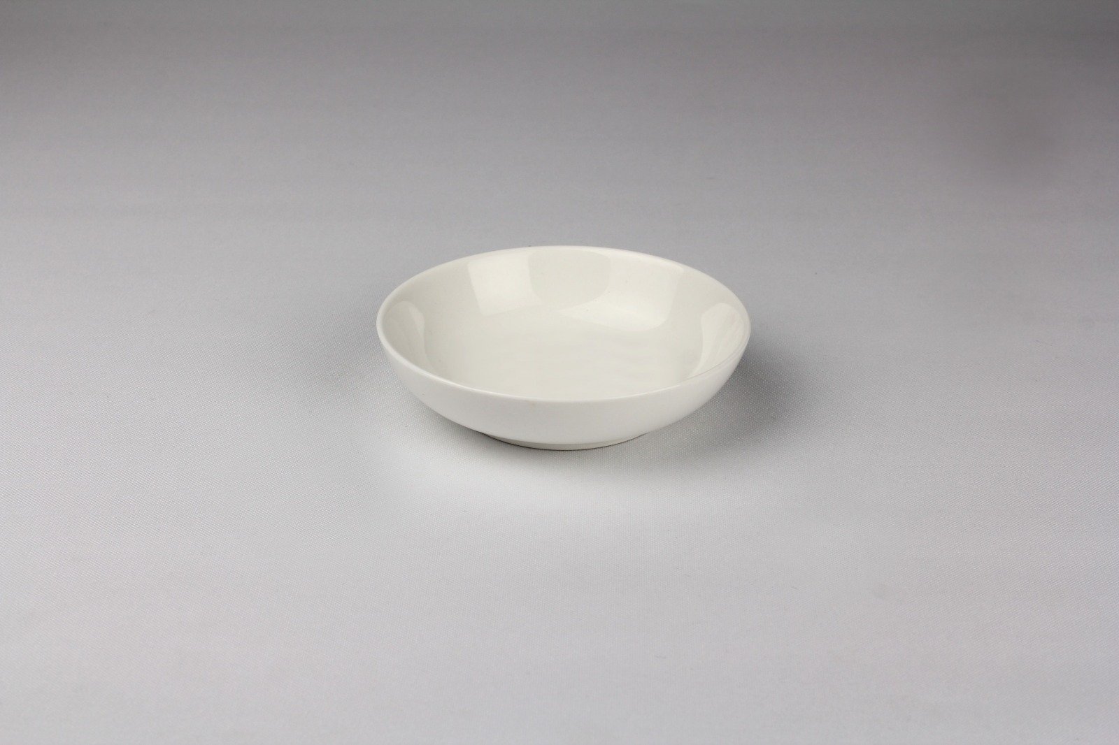 Round porcelain white soy dish, 3 inches in diameter, perfect for sauces and appetizers.