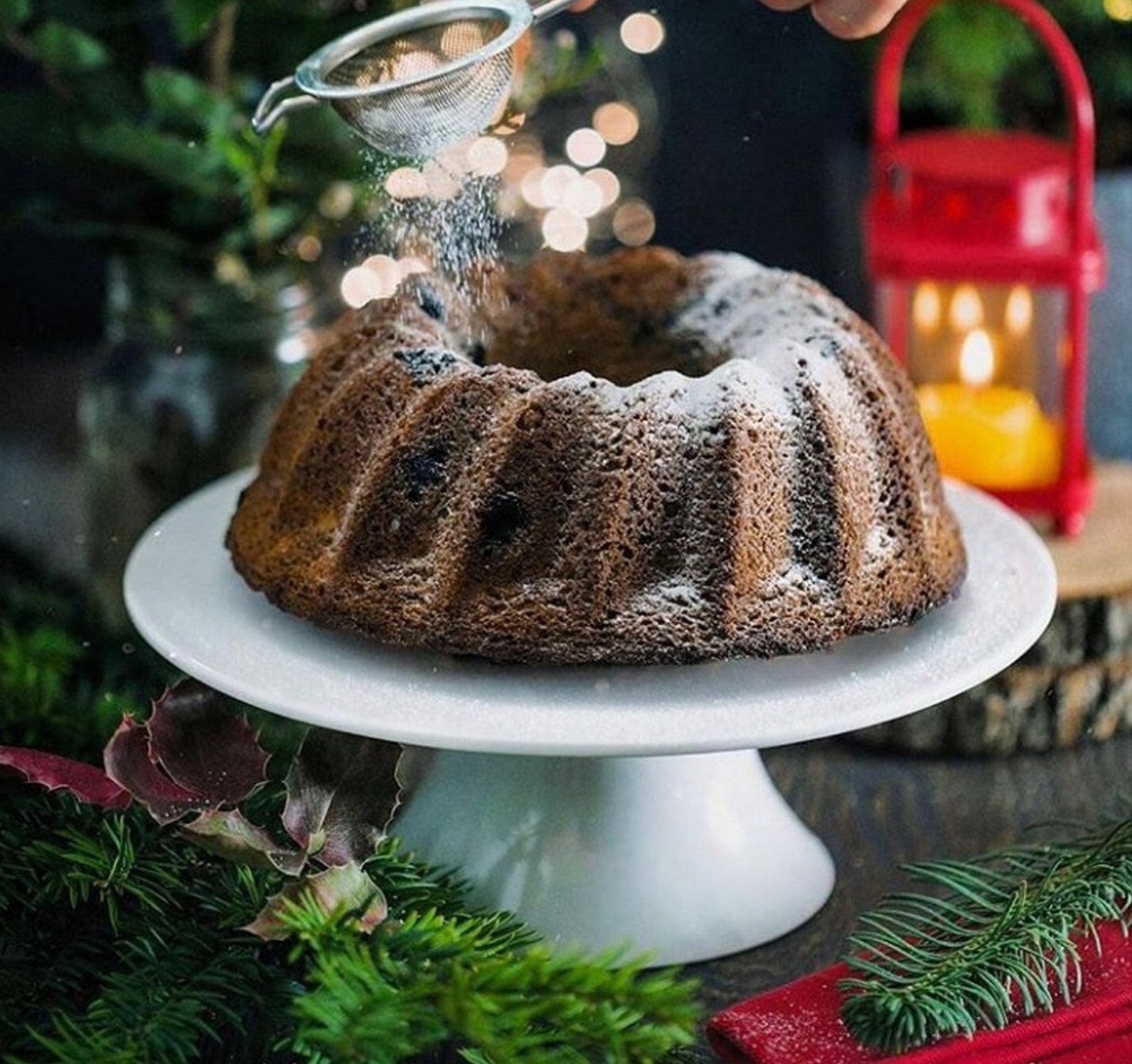 Elegant round white porcelain cake stand, 12 inches in diameter, perfect for displaying cakes and desserts.