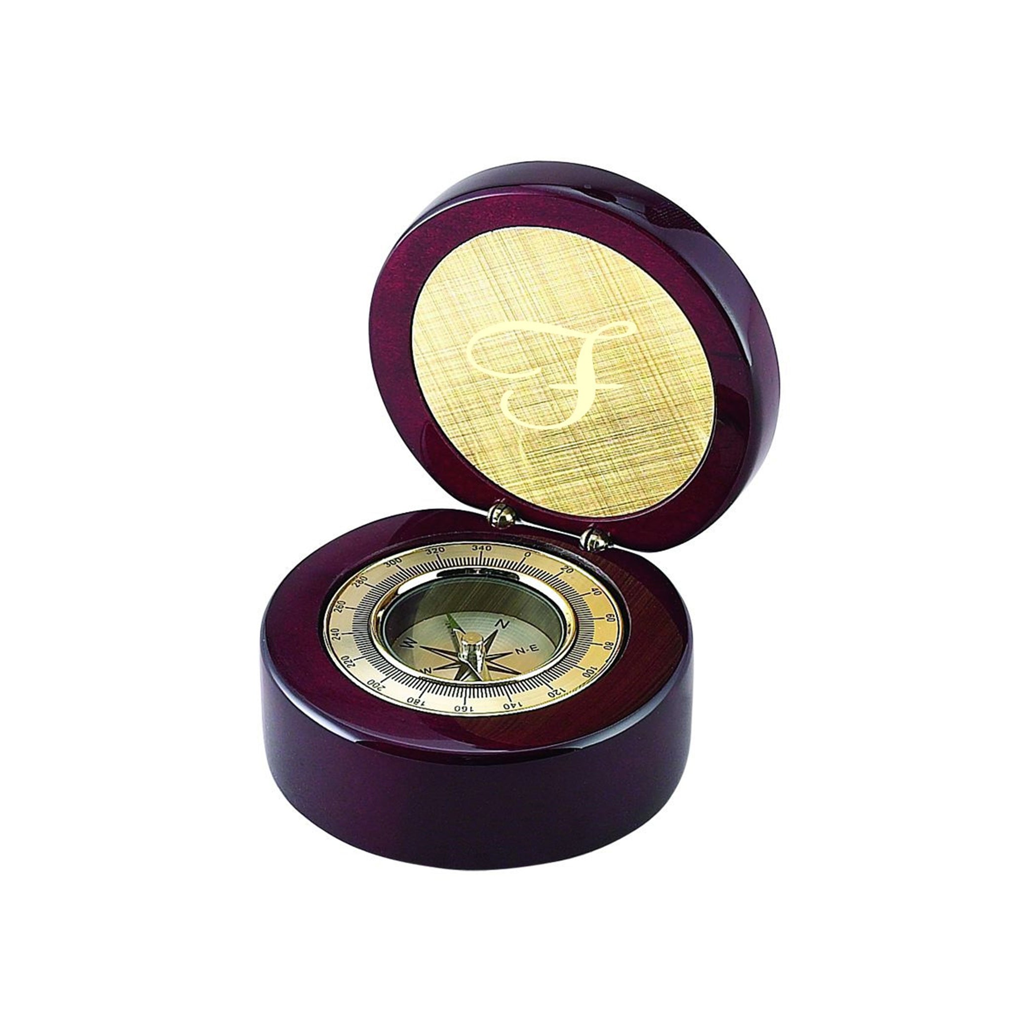 Round wooden box with gold accented compass and engraving plate in rosewood finish.