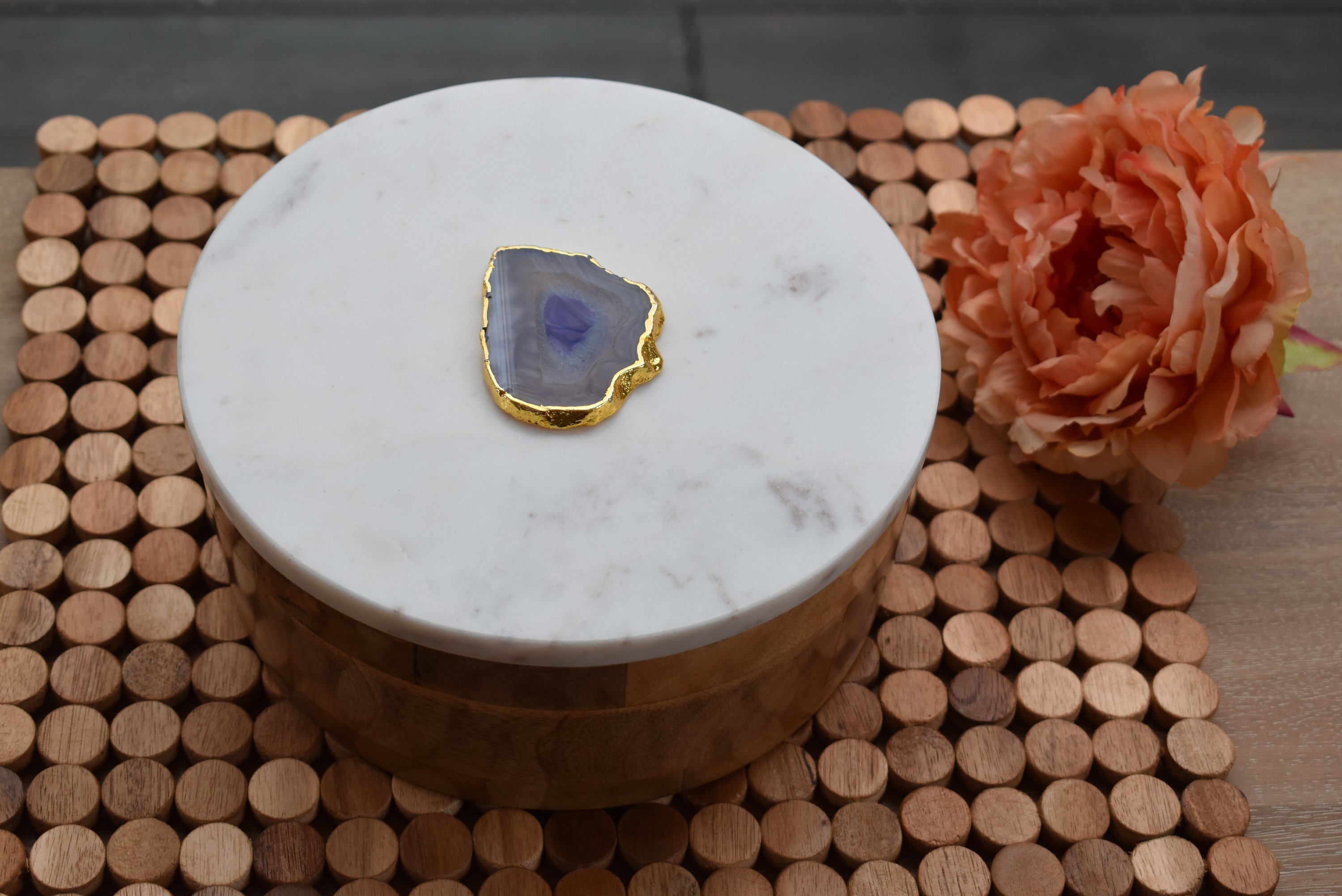 Round wooden box with a white marble lid and natural agate trim, elegantly designed for jewelry storage.