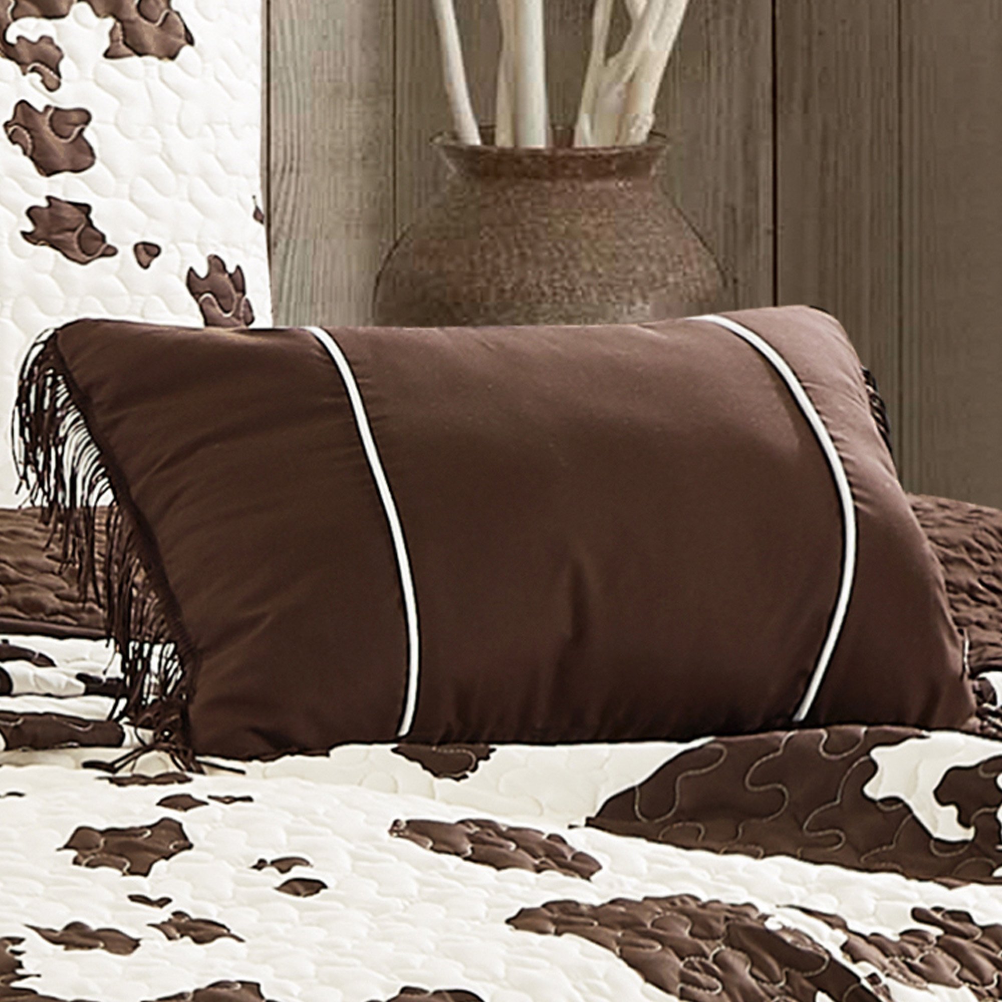 Rustic Cowhide Brown Cow Skull Quilt Set featuring a luxurious bedspread, pillow shams, and decorative pillows in a Western design.