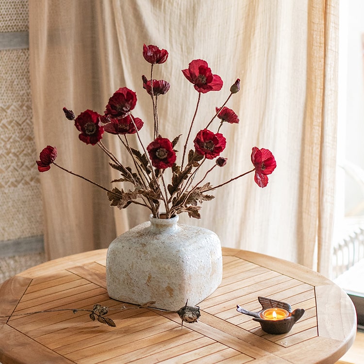 A 23-inch tall Rustic Poppy Flower Stem in dark red with three blooms and one bud, featuring green leaves, perfect for home decor.