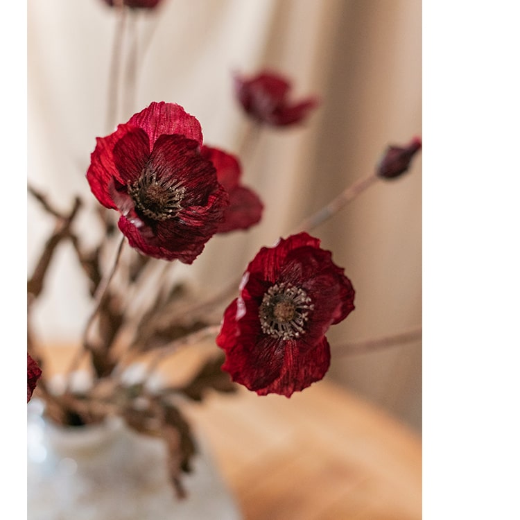 A 23-inch tall Rustic Poppy Flower Stem in dark red with three blooms and one bud, featuring green leaves, perfect for home decor.