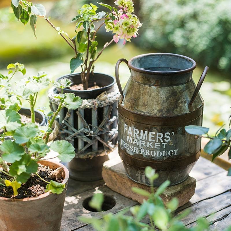 Rusty Metal Barrel flower pot with a vintage design, showcasing its gray and rusty color finish, perfect for indoor and outdoor use.