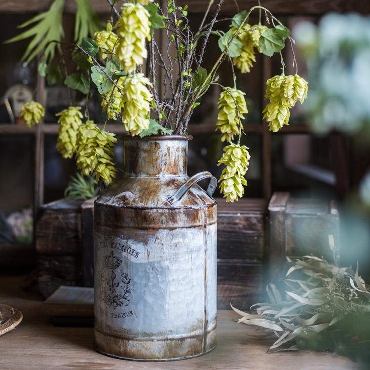 Rusty Metal Barrel flower pot with a vintage design, showcasing its gray and rusty color finish, perfect for indoor and outdoor use.