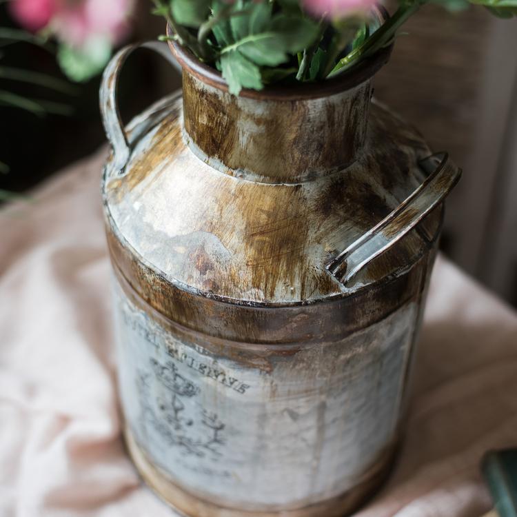 Rusty Metal Barrel flower pot with a vintage design, showcasing its gray and rusty color finish, perfect for indoor and outdoor use.