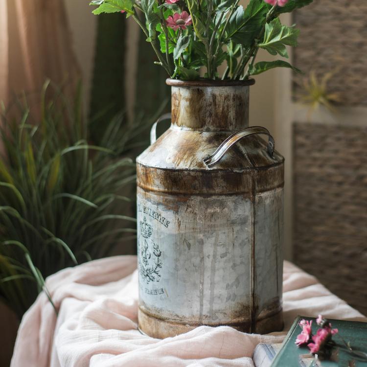 Rusty Metal Barrel flower pot with a vintage design, showcasing its gray and rusty color finish, perfect for indoor and outdoor use.