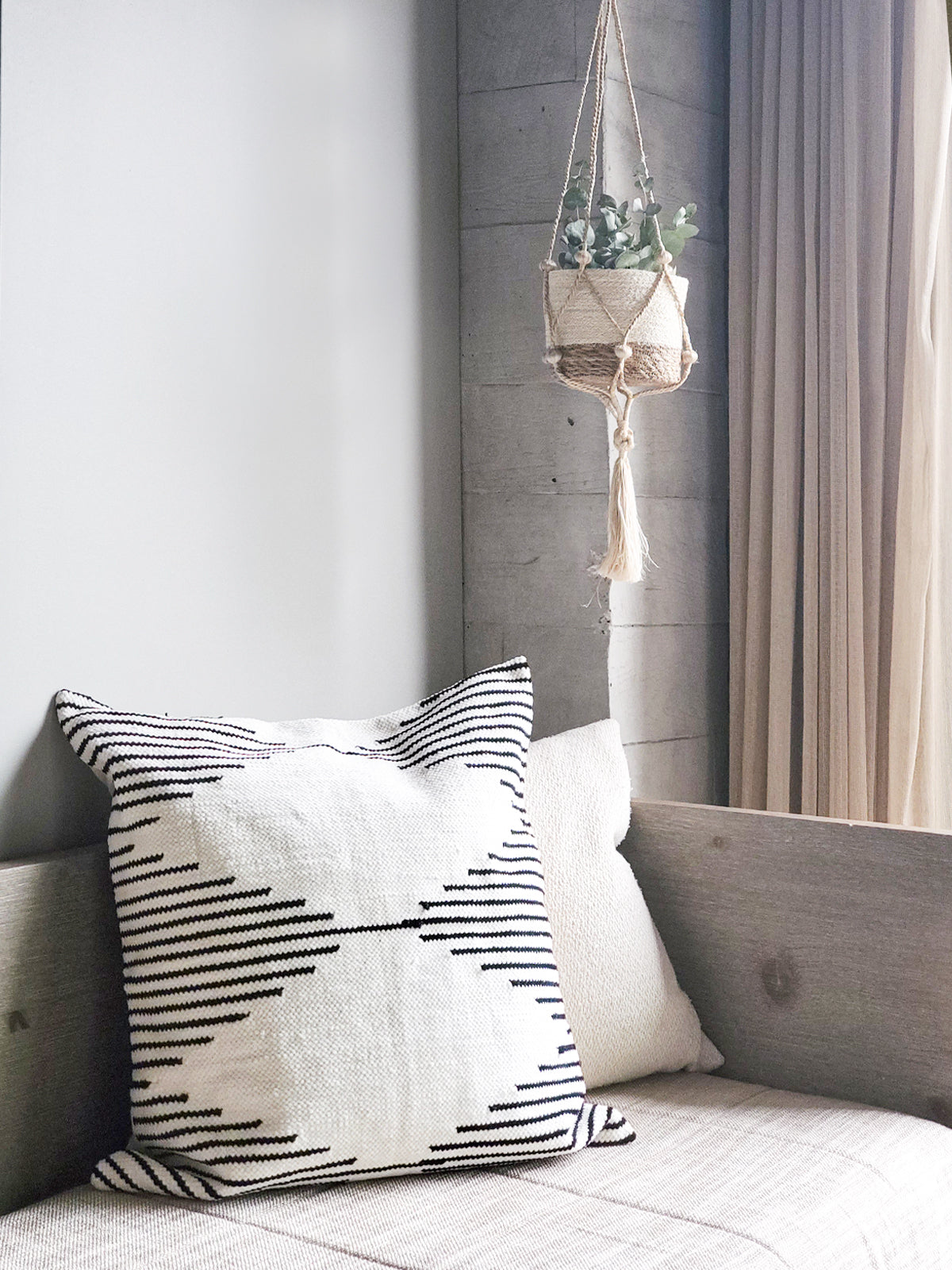 Sada Pillow Cover made from recycled chenille, featuring a soft texture and neutral black and white design, perfect for home decor.