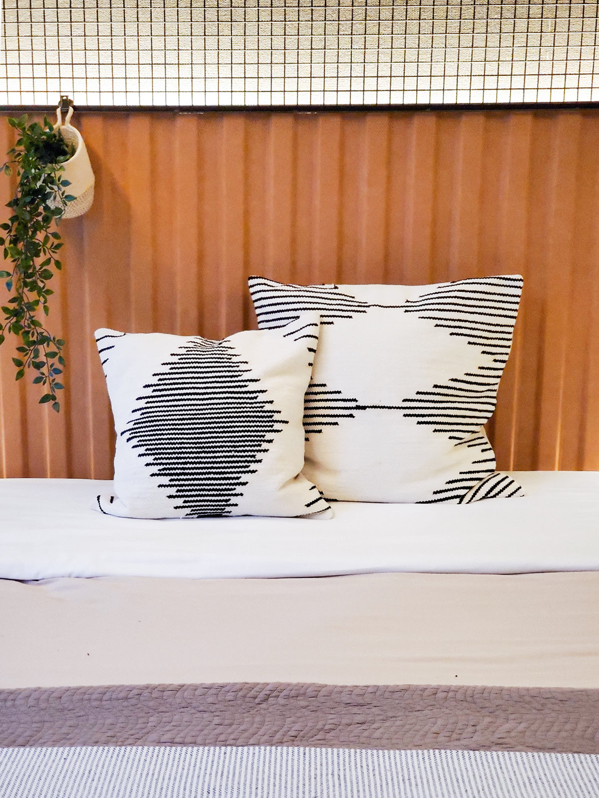 Sada Pillow Cover made from recycled chenille, featuring a soft texture and neutral black and white design, perfect for home decor.