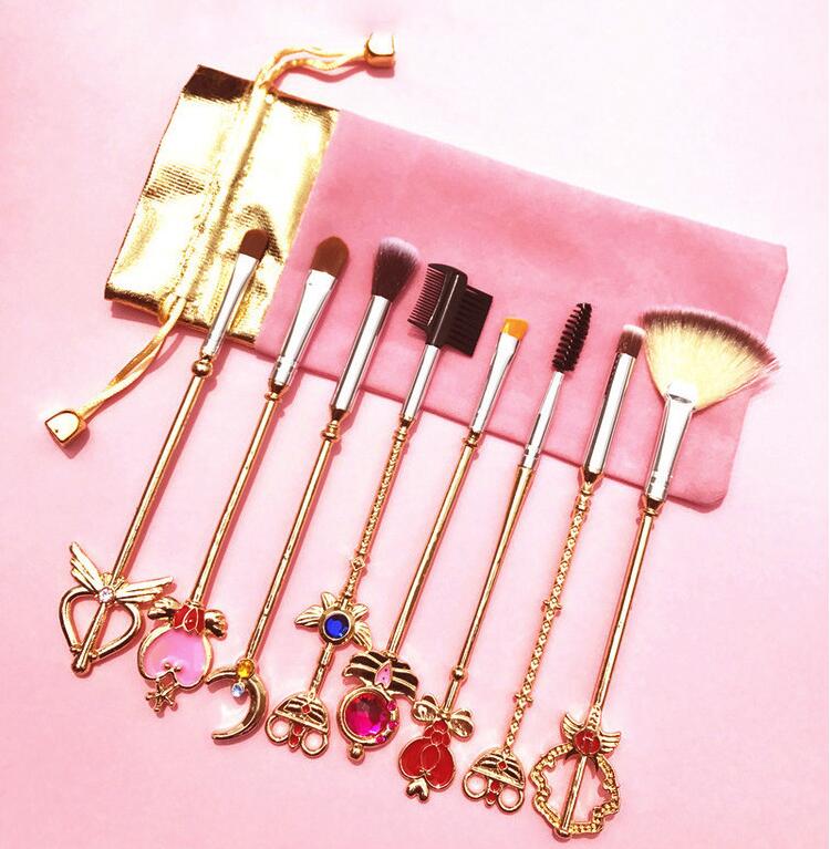 A set of 8 professional makeup brushes inspired by Sailor Moon and Cardcaptor Sakura, featuring soft synthetic bristles and elegant metal handles.