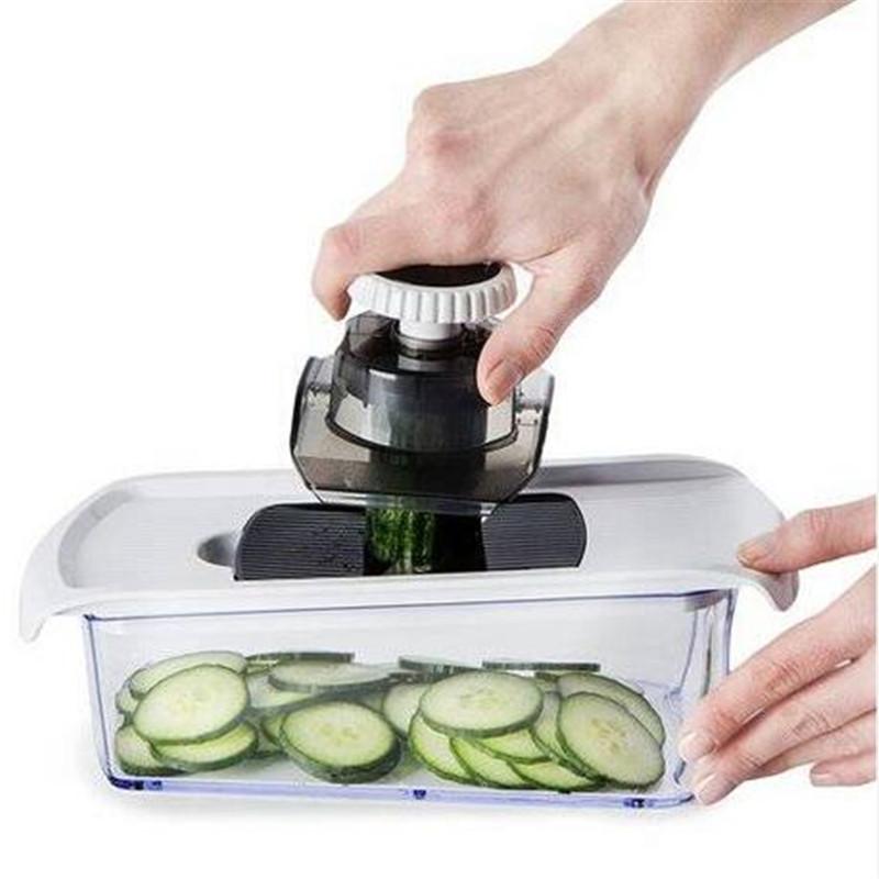 A versatile 7-in-1 Vegetable Chopper Mandoline Slicer with multiple blades and a catch tray, ideal for slicing and dicing vegetables safely.