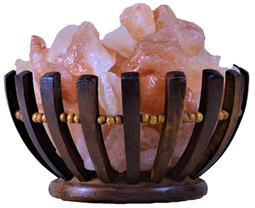 Himalayan salt lamp in a beautifully hand-carved rosewood basket, showcasing unique salt chunks and warm glow.