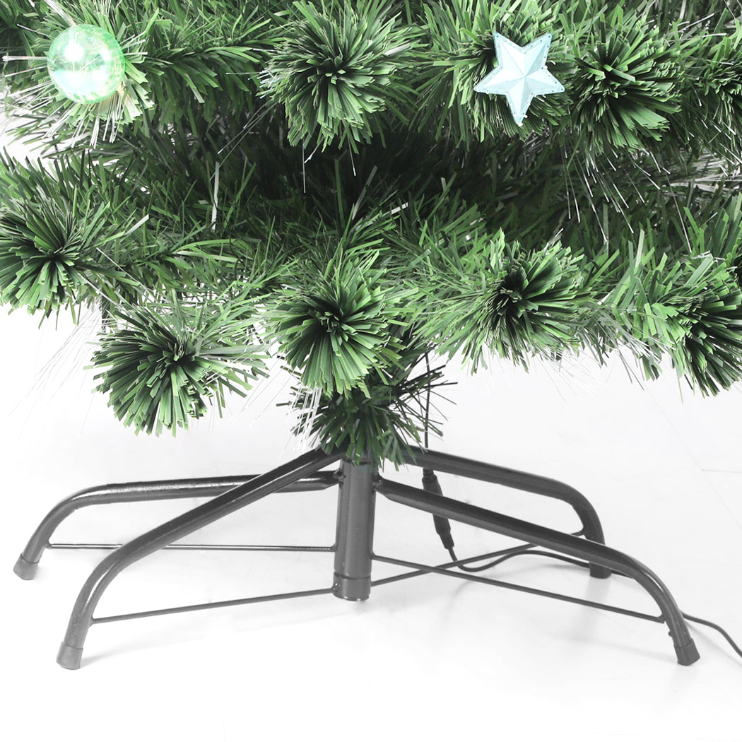 SANTACO 2.4M Christmas Tree with fibre optic lights and decorations, showcasing realistic PVC pine needles and a stable steel base.