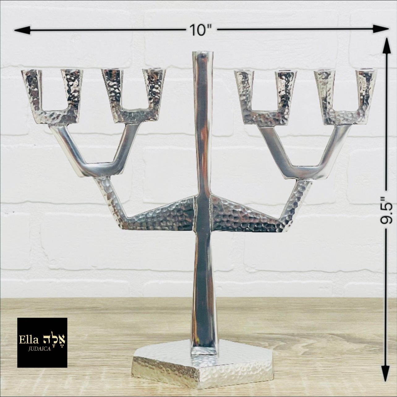 A modern Sapling Menorah inspired by tree branches, made of aluminum with a shiny nickel finish, standing 9.5 inches tall.