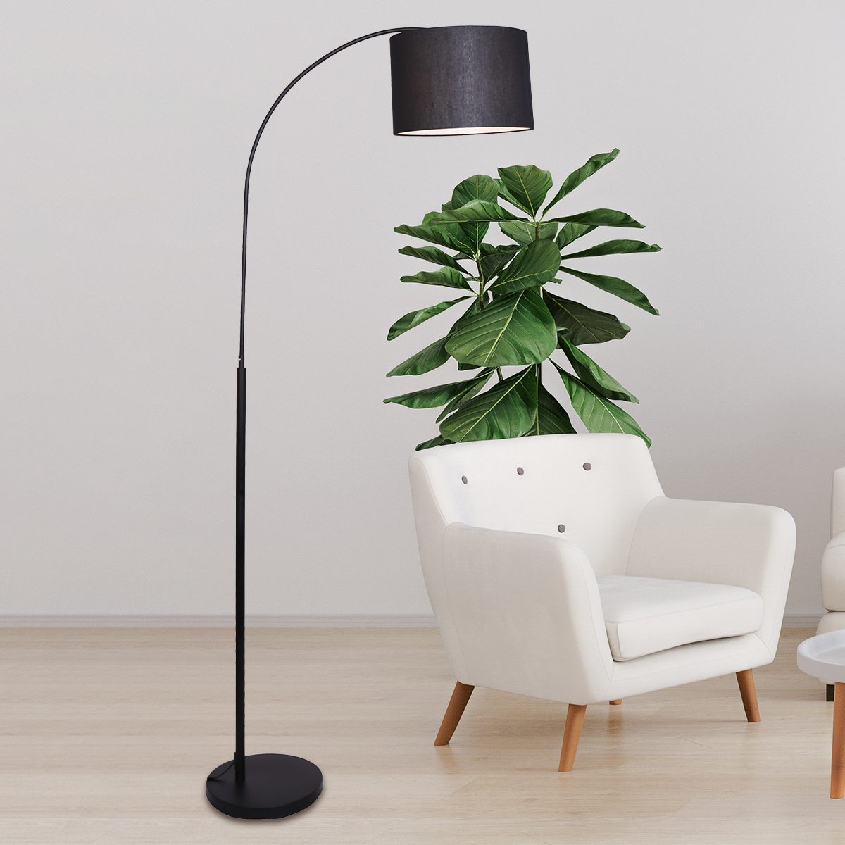 Sarantino Metal Arc Arm Floor Lamp with Black Drum Shade, showcasing a sleek design and arched frame, perfect for modern interiors.