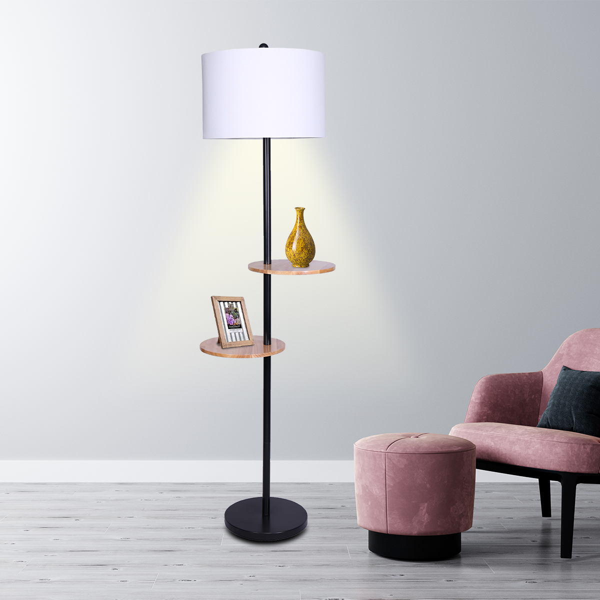 Sarantino Metal Floor Lamp with black post and round wooden shelves, showcasing a modern design and white drum shade.