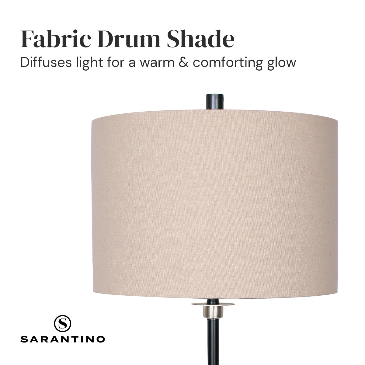 Sarantino Metal Table Lamp with a cream linen drum shade and black metal base, showcasing a modern and elegant design.