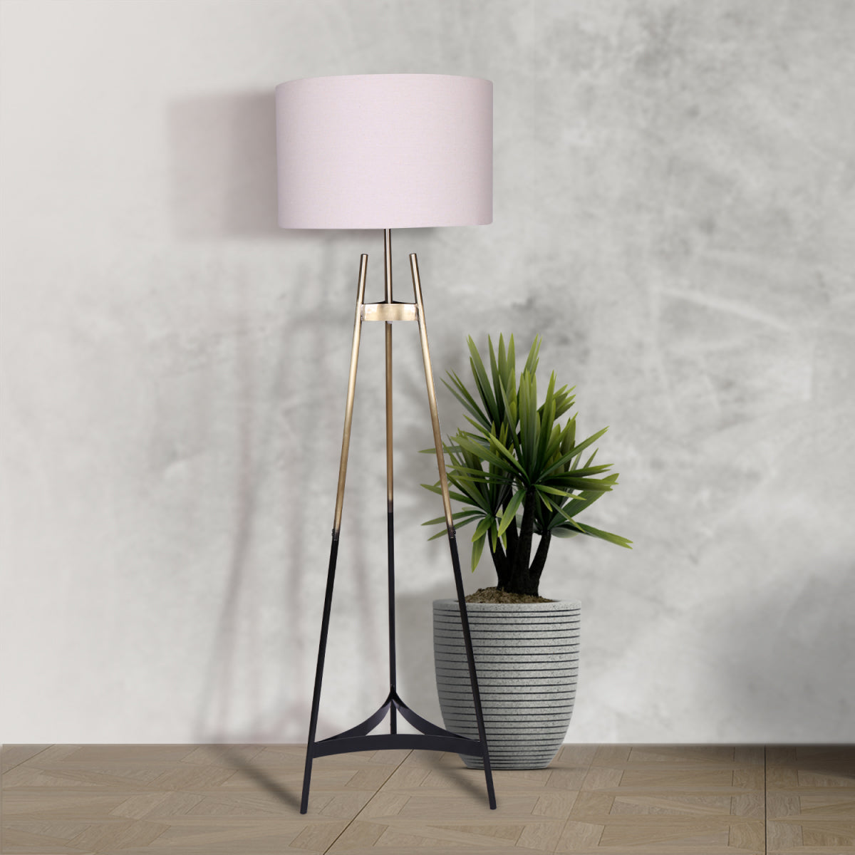 Sarantino Metal Tripod Electric Floor Lamp with gradient gold and black finish and neutral linen drum shade, elegantly designed for modern interiors.