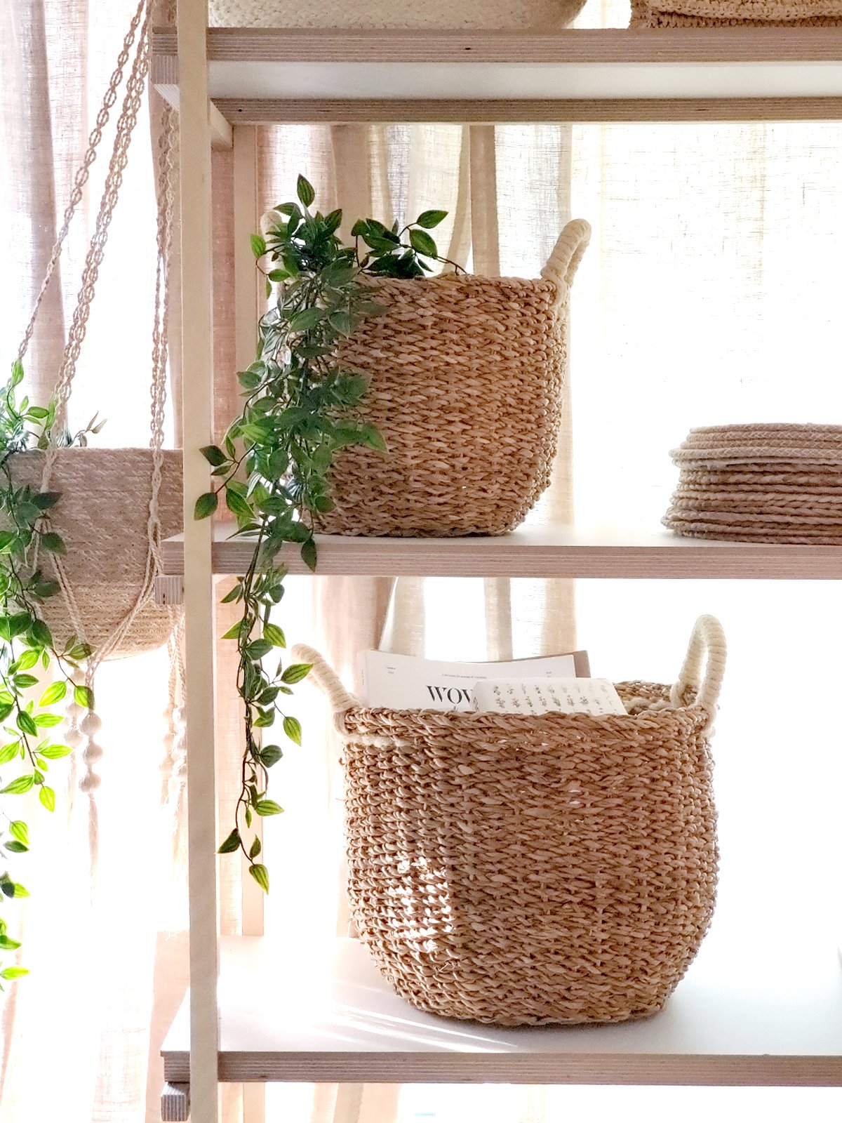 Savar Basket with White Handle made from natural seagrass, showcasing its elegant design and practical storage capabilities.