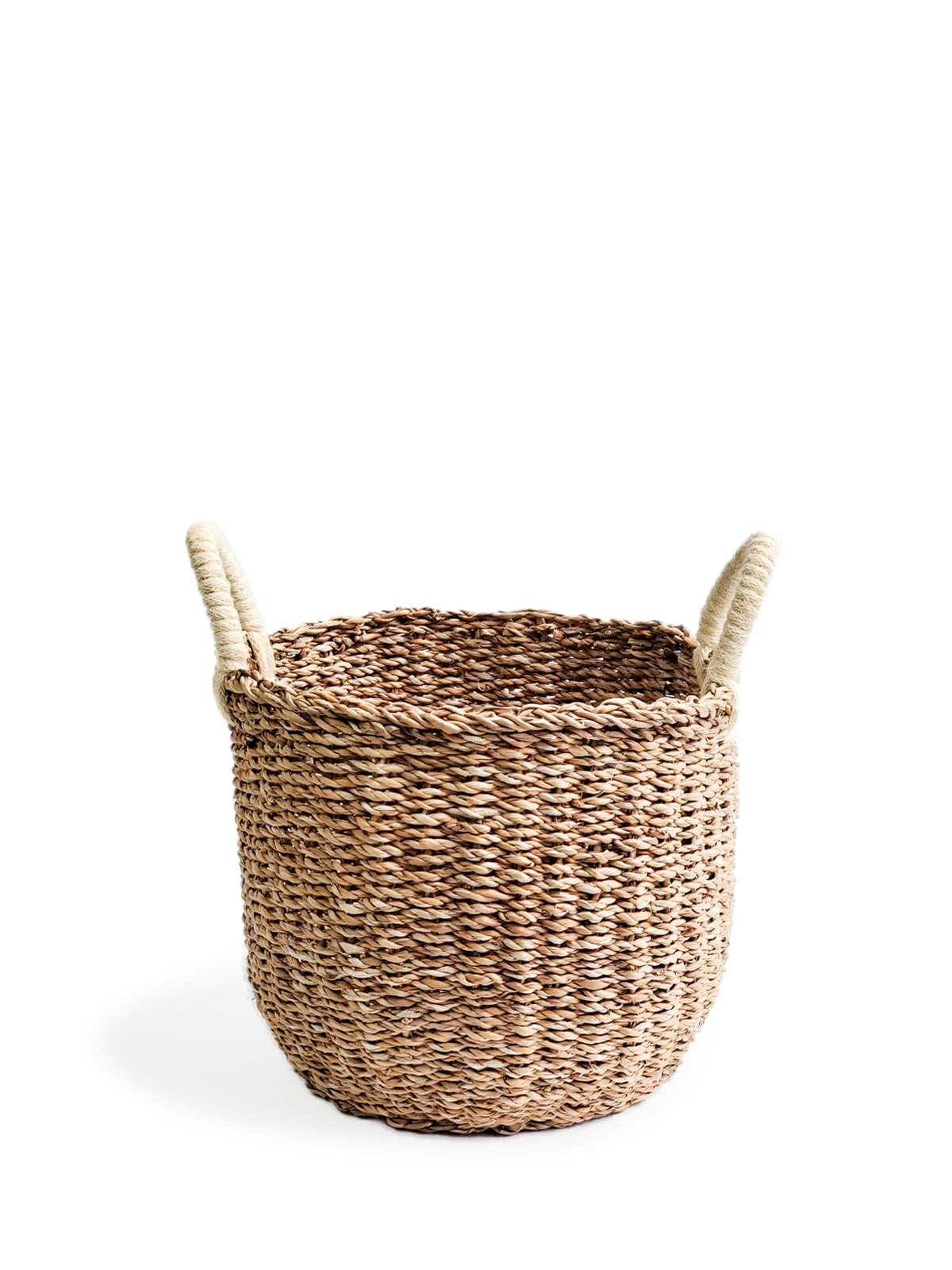 Savar Basket with White Handle made from natural seagrass, showcasing its elegant design and practical storage capabilities.