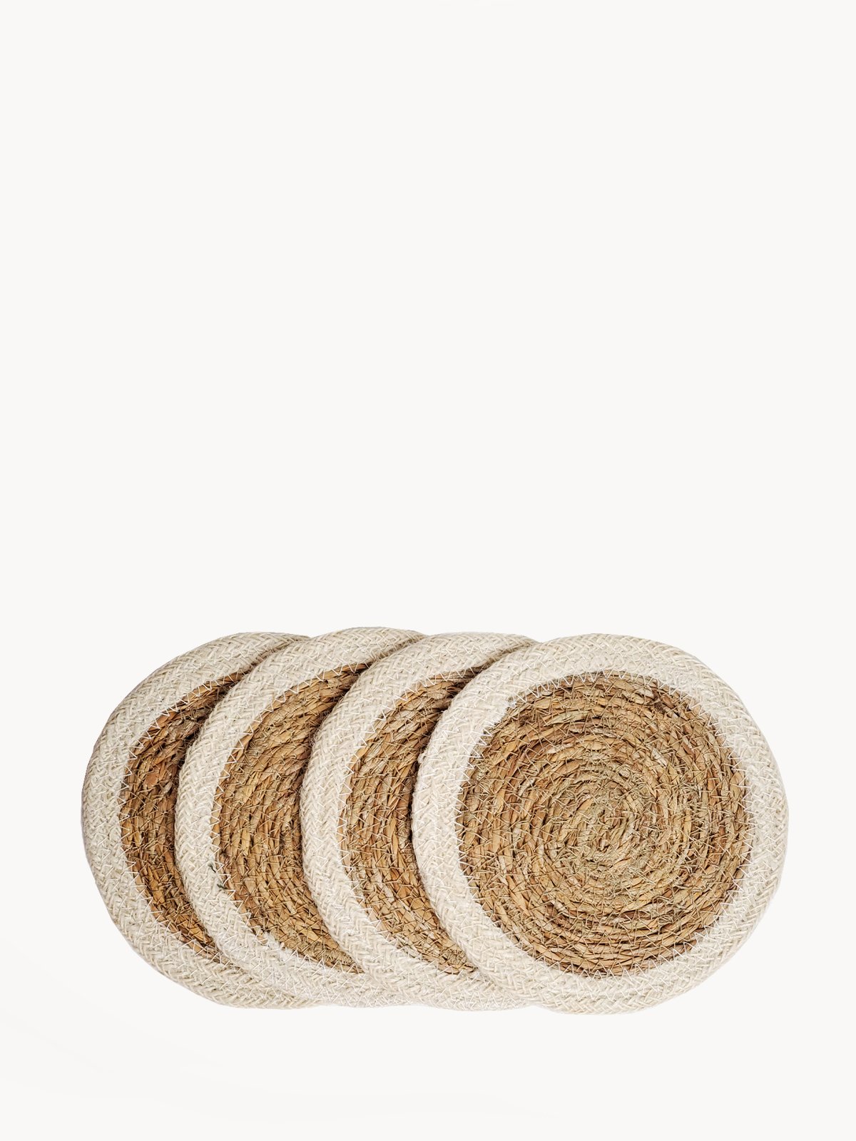 Set of 4 Savar Coasters made from natural seagrass and jute, showcasing their round shape and neutral colors.