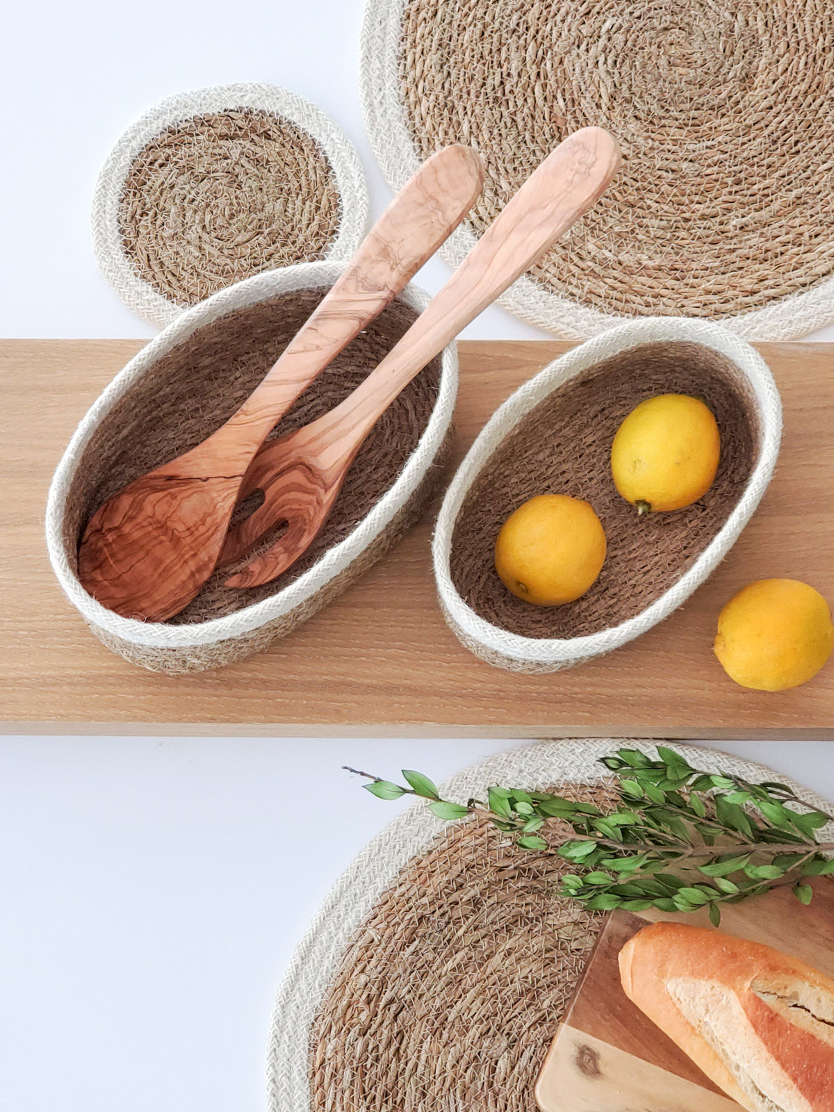 Set of 3 Savar Oval Bowls made from seagrass and jute, showcasing their natural and white colors.