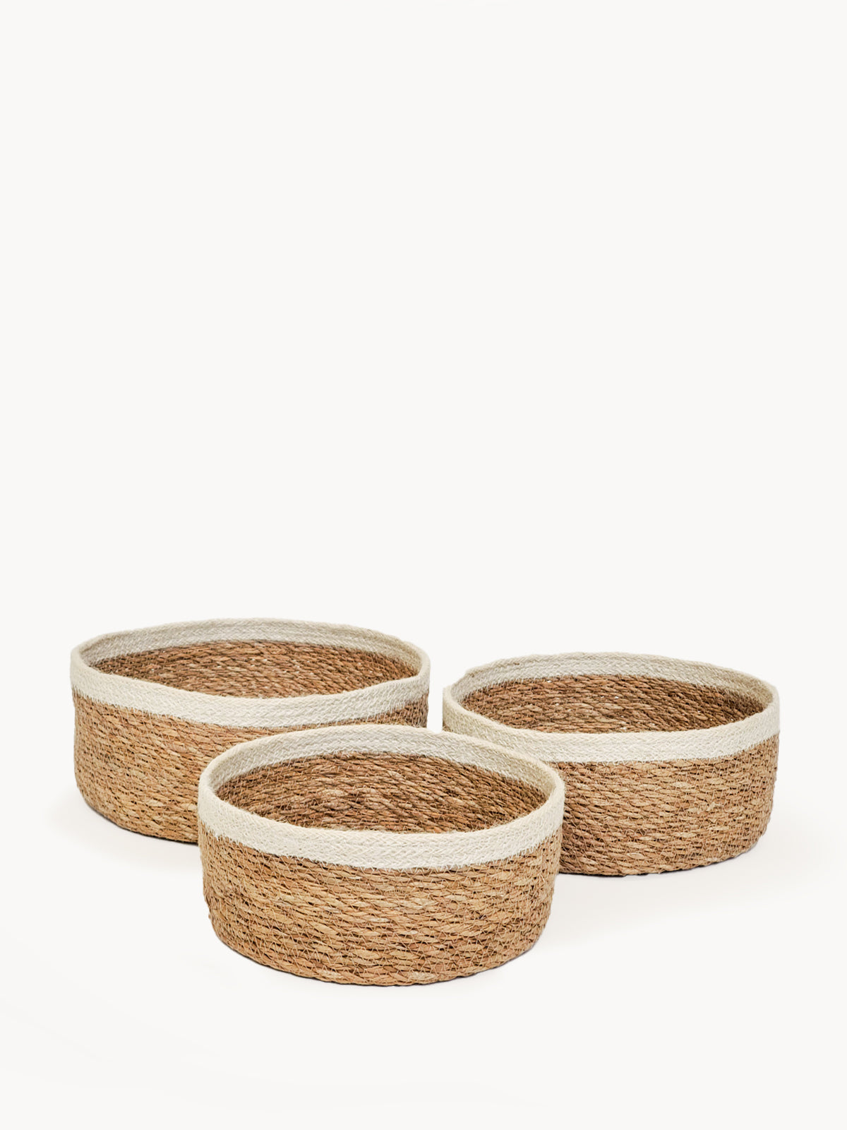 Set of 3 Savar Storage Bowls made from seagrass and jute, showcasing natural colors and handcrafted design.