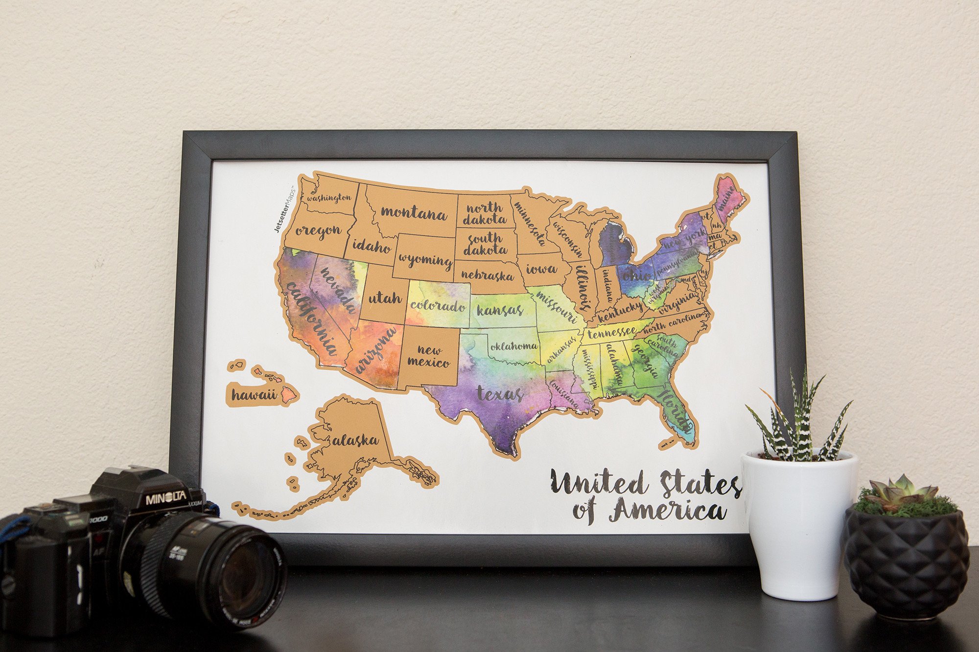 Scratch Your Travels® USA Map featuring vibrant watercolor states, perfect for tracking travels.