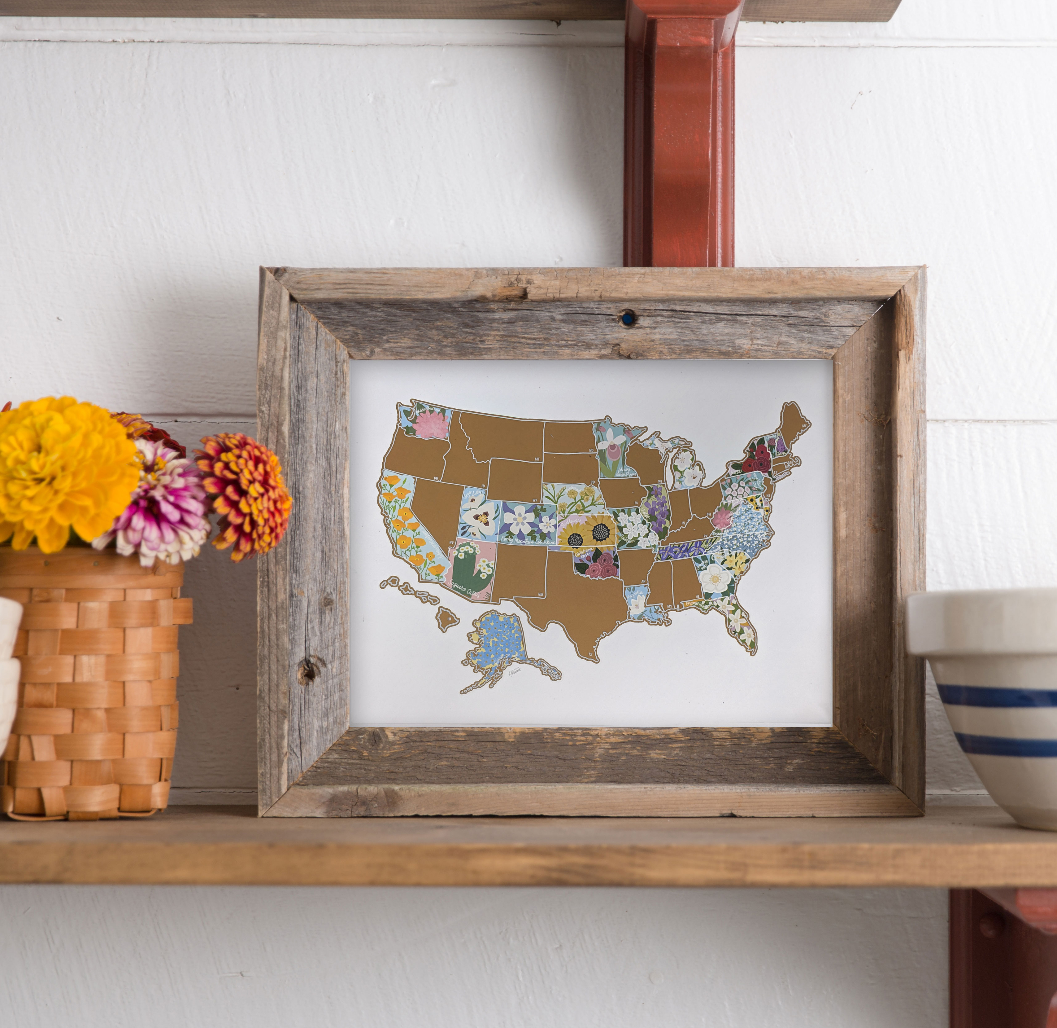 Scratch Your Travels® USA State Flowers Map with gold scratch-off finish, showcasing hand-drawn flowers for each state.