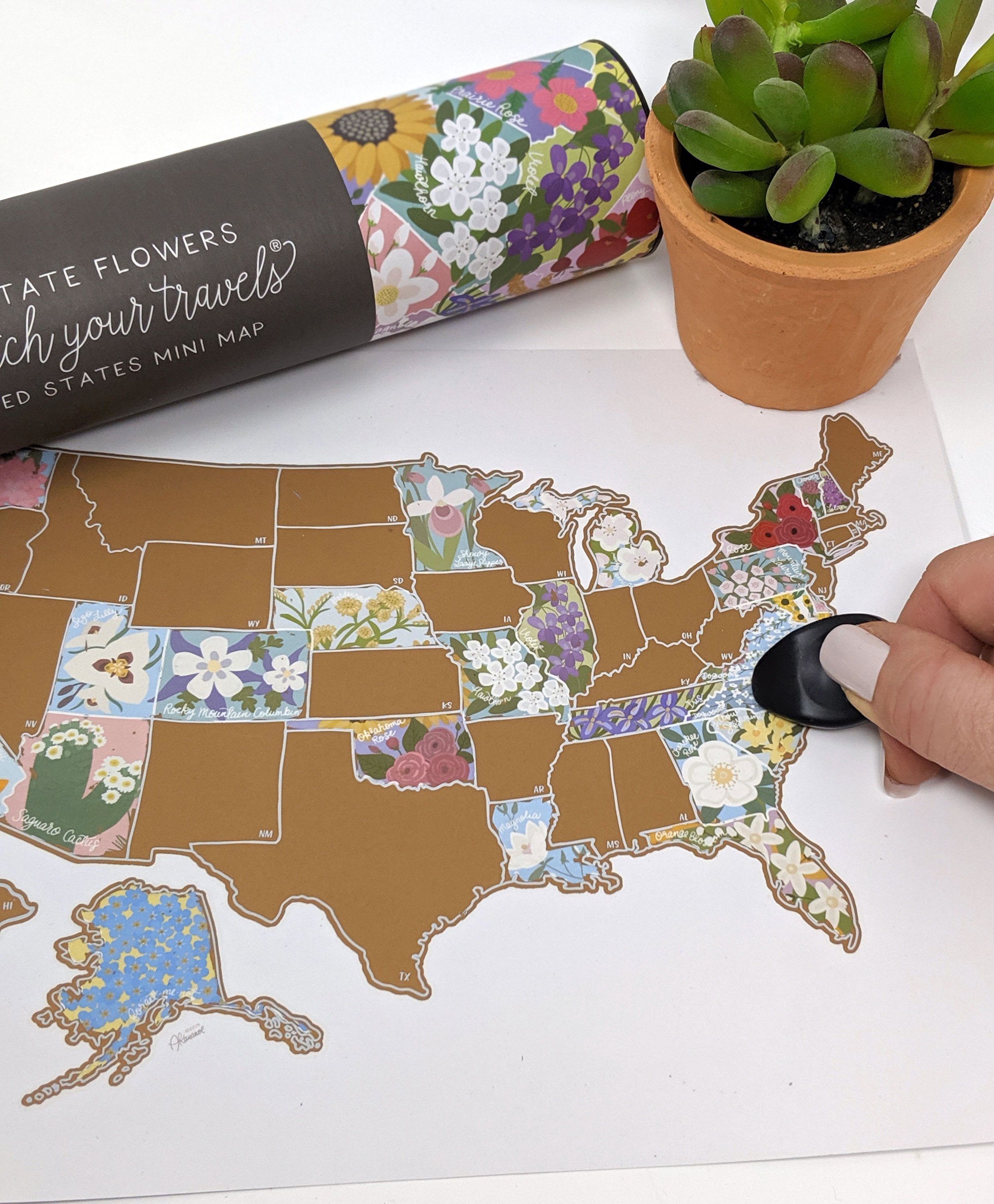 Scratch Your Travels® USA State Flowers Map with gold scratch-off finish, showcasing hand-drawn flowers for each state.