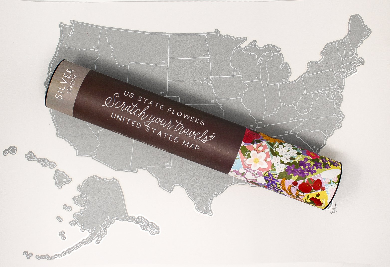 Scratch Your Travels® USA State Flowers Map with gold scratch-off finish, showcasing hand-drawn flowers for each state.