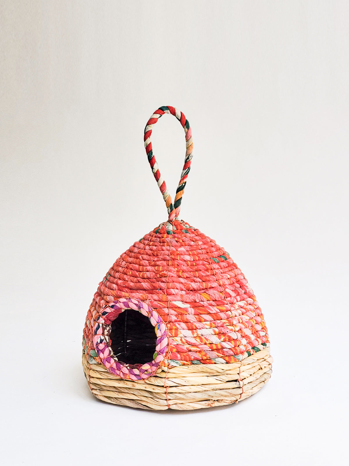 Handcrafted Seagrass & Sari Birdhouse featuring vibrant sari fabrics and natural seagrass, perfect for garden decor.