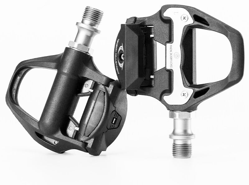 Shimano SPD-SL self-lock clip-in bike pedals with cleats, showcasing aluminum alloy body and sealed bearings.