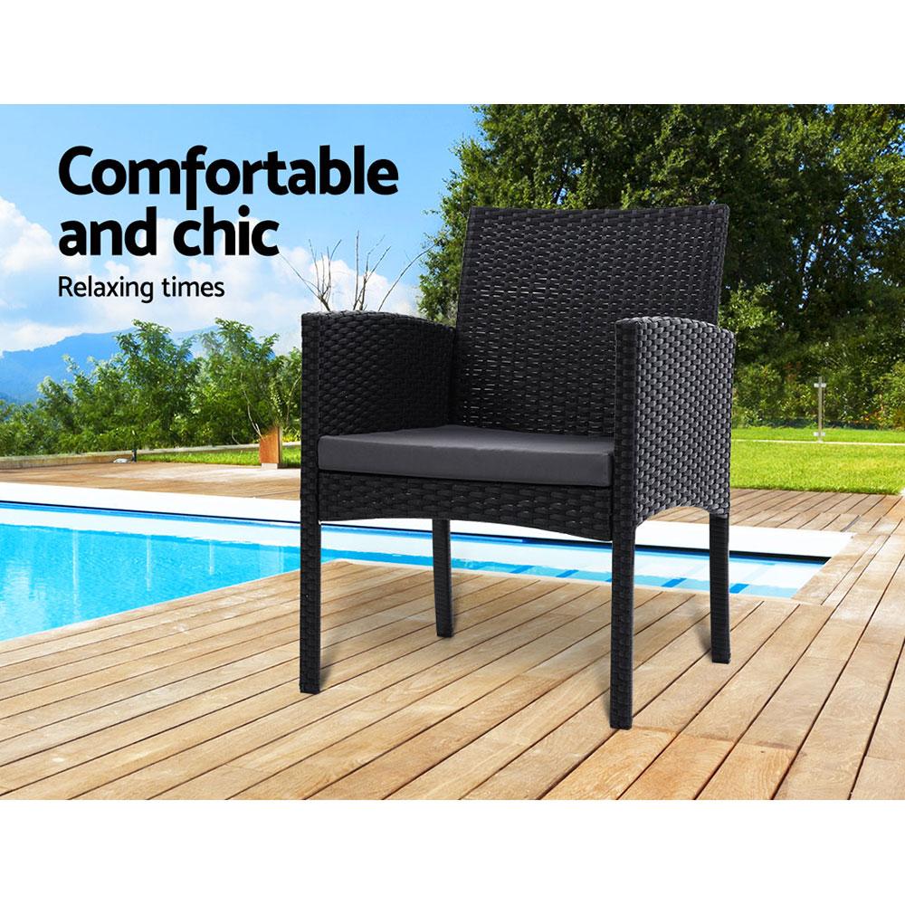 Set of 2 outdoor bistro chairs made of UV-resistant PE wicker with grey cushions, perfect for patio or deck use.