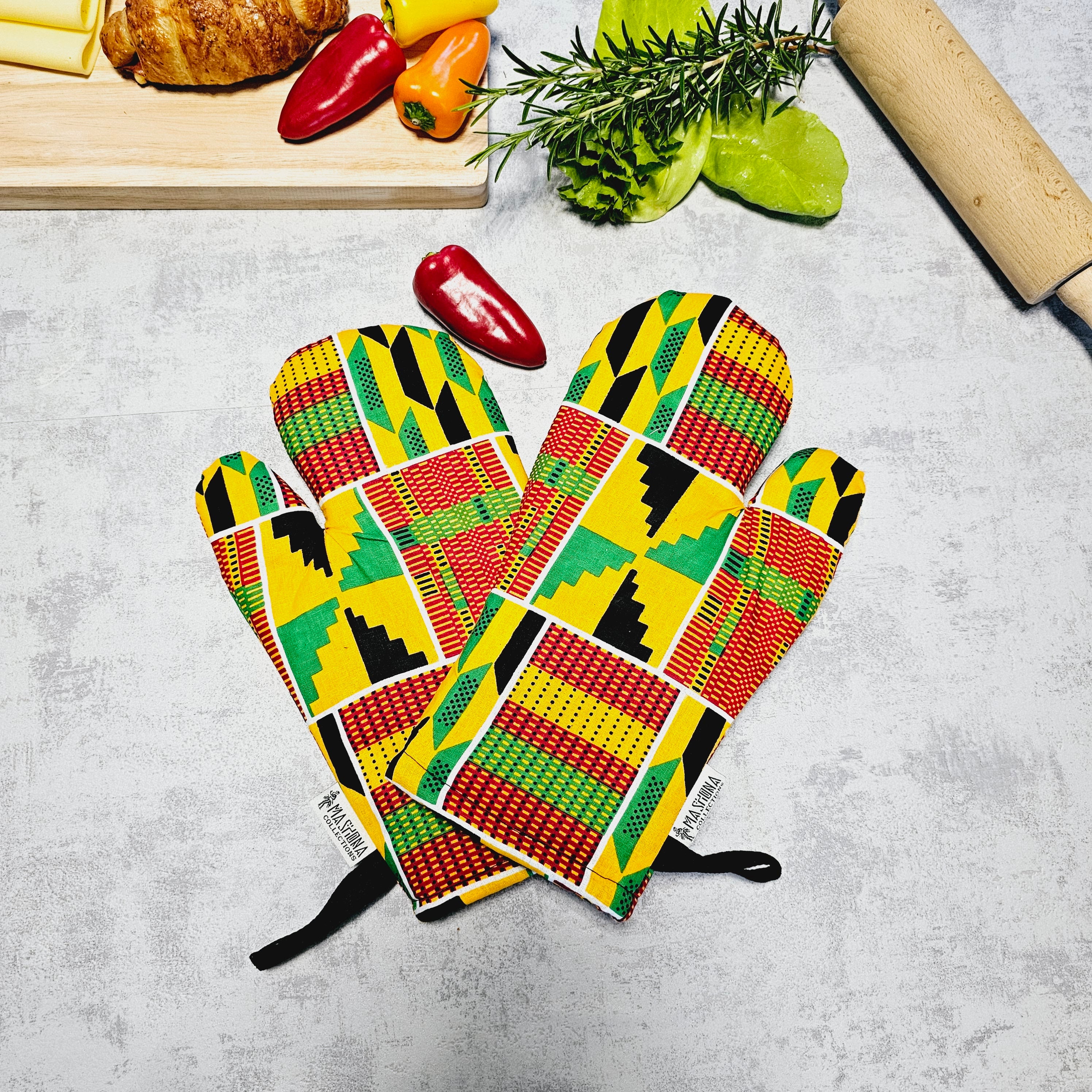 Set of 2 handmade oven gloves featuring vibrant Mudcloth Bogolan print, designed for heat resistance and style in the kitchen.