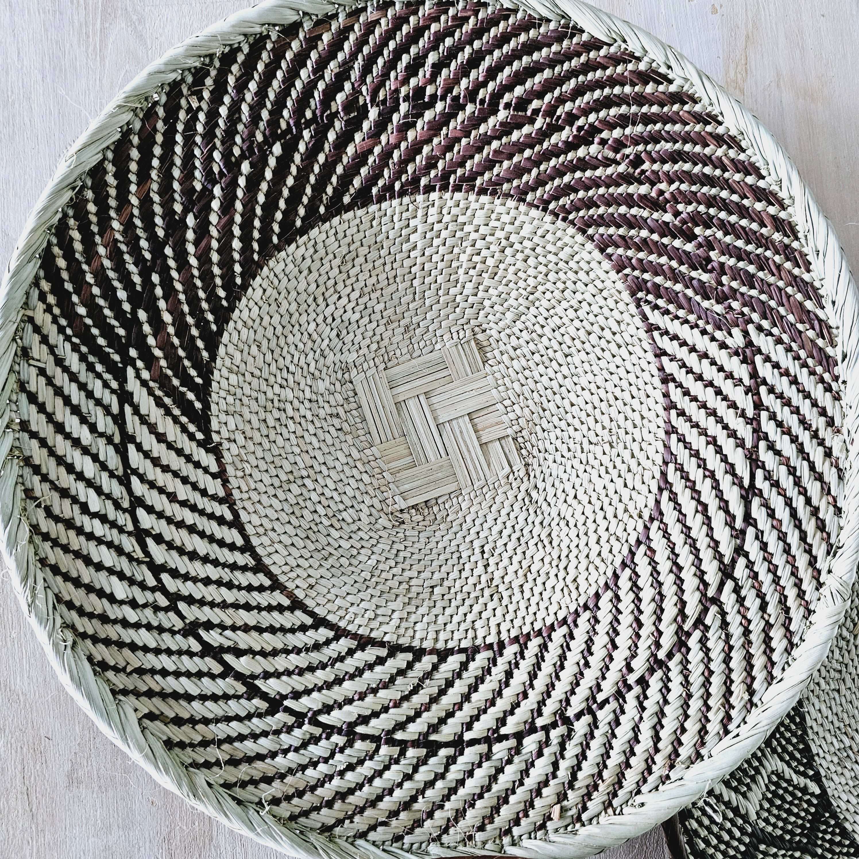 Set of 4 handmade African baskets from Zimbabwe, showcasing intricate patterns and natural materials, perfect for Boho wall decor.