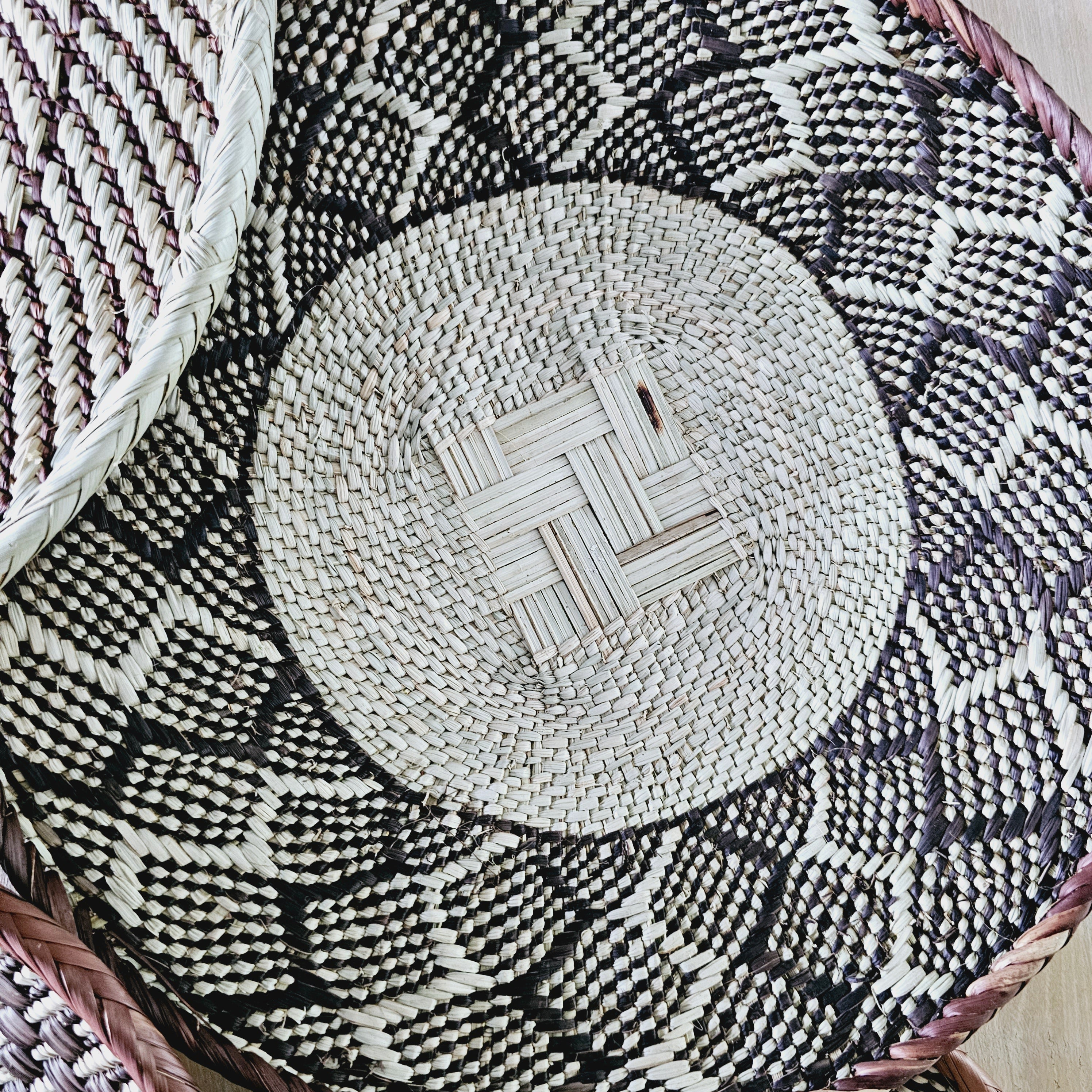 Set of 4 handmade African baskets from Zimbabwe, showcasing intricate patterns and natural materials, perfect for Boho wall decor.